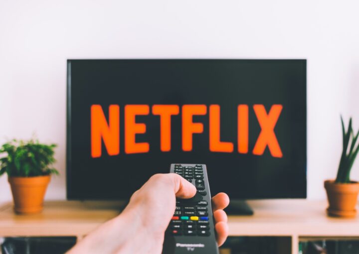 Free Person Holding a Remote Control Stock Photo